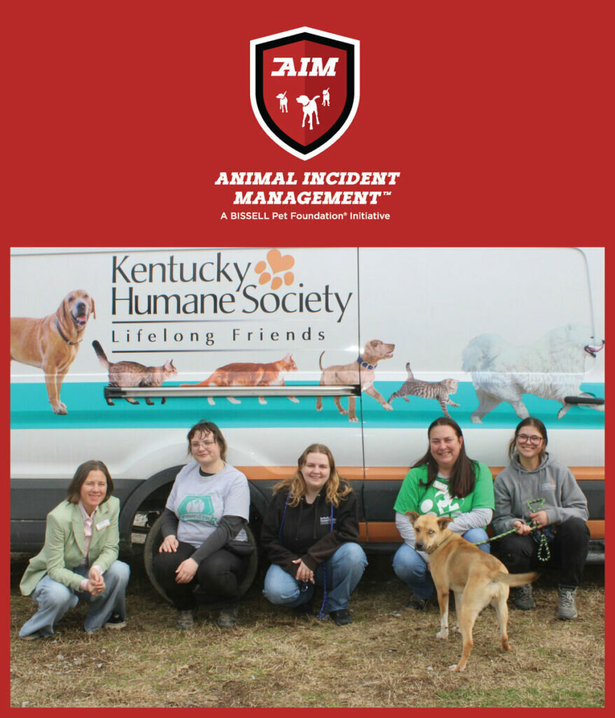 Five people, one holding a dog on a leash, sit and kneel in front of a Kentucky Humane Society van with animal graphics. The image has a red border with the Animal Incident Management logo at the top.